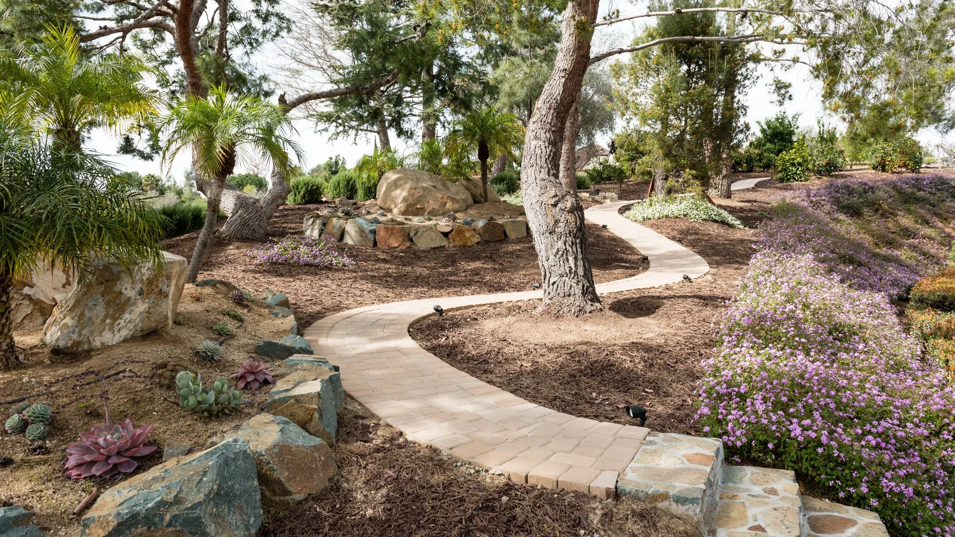 Landscaping with shrubs and flowers.