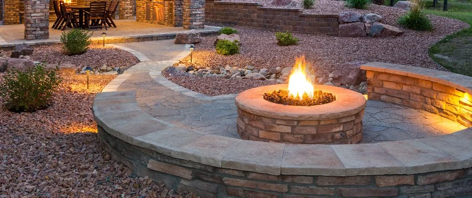 A fire pit with a seating wall.