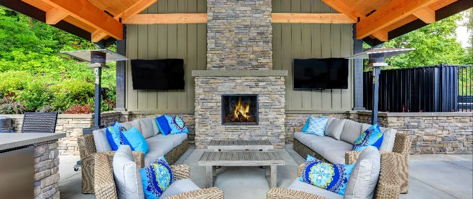 An outdoor fireplace with seating in Encinitas, CA.